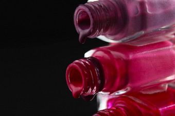 美背景储蓄者指甲波兰的倒罐瓶紫色的红色的勃艮第粉红色的特写镜头视图一边