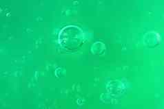 纹理透明的绿色过来这里空气泡沫波光单色背景