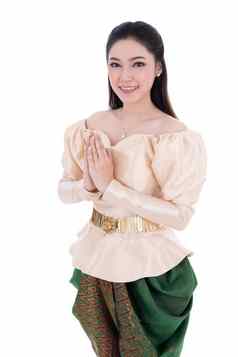 女人泰国传统的衣服支付尊重孤立的白色背景
