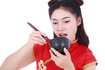女人穿中国人<strong>旗袍</strong>衣服筷子碗孤立的白色背景