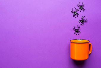橙色杯子紫色的背景蜘蛛概念万圣节假期<strong>可怕</strong>的风景<strong>可怕</strong>的喝有趣的复制空间模拟断然