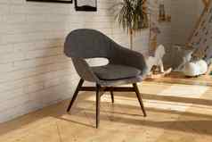 舒适的灰色扶手椅绿色植物能室内家具概念