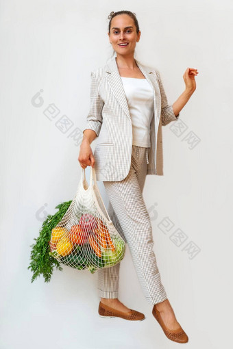 女人光西装持有棉花购物者可重用的<strong>网购</strong>物袋蔬菜浪费塑料概念复制空间环保网买家