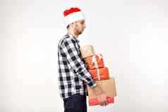 假期礼物概念有趣的男人。圣诞节圣诞老人他持有礼物盒子白色背景