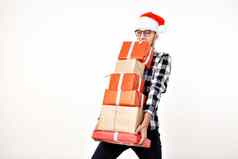 假期礼物概念有趣的男人。圣诞节圣诞老人他持有礼物盒子白色背景