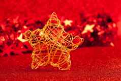 圣诞节黄金线明星红色的闪闪发光的