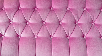 纹理粉红色的织物<strong>沙发背景</strong>