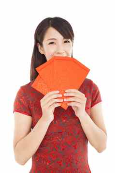 微笑中国人女人持有红色的袋快乐中国人一年