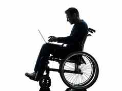 残疾男人。计算移动PC电脑轮椅silhoue