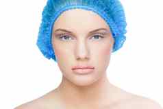 漂亮的模型穿蓝色的外科手术帽