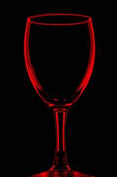 透明的红色的空酒玻璃黑色的