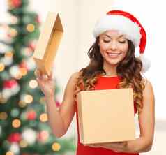 微笑女人圣诞老人助手他礼物盒子