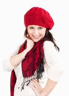 年轻的女人红色的帽围巾微笑