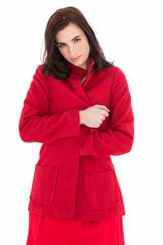 漂亮的浅黑肤色的女人红色的外套摆姿势
