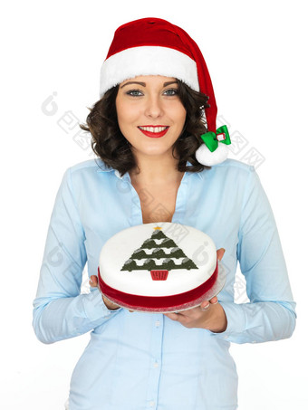 年轻的女人<strong>圣诞老人</strong>他持有圣诞节水果<strong>蛋糕</strong>