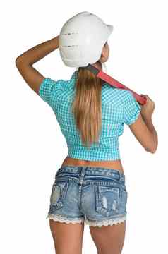 美丽的女孩白色头盔短裤衬衫持有施工水平肩膀完整的长度后视图