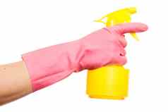 手粉红色的手套持有喷雾瓶