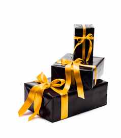 黑色的礼物盒子黄色的缎丝带弓