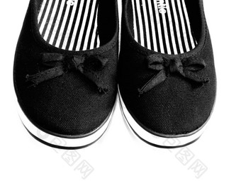 白色黑色的橡胶底帆布鞋