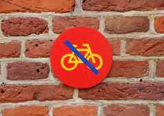 自行车停车标志红色的瓷砖墙