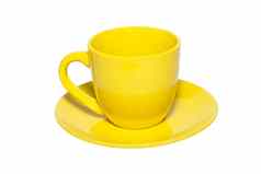 黄色的陶瓷杯飞碟孤立的白色