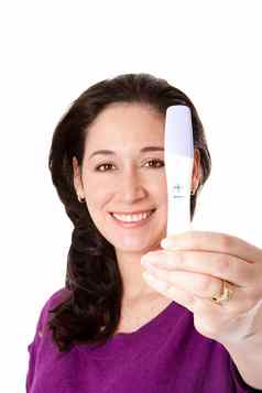 快乐女人积极的怀孕测试