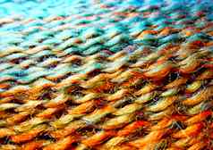 一束羊毛纱宏拍摄纹理波浪线程明亮的多色线程背景图像爱好休闲工艺品