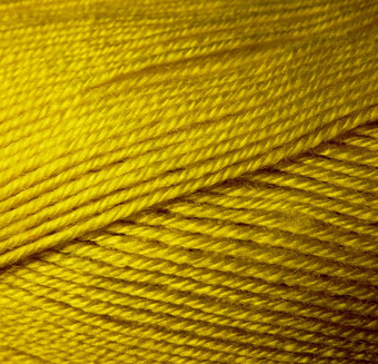 一束羊毛纱宏拍摄纹理<strong>波浪线</strong>程黄色的绿色线程背景图像爱好休闲工艺品