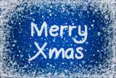 圣诞节蓝色的背景快乐圣诞节文本雪写作