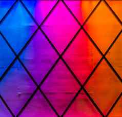 现代色彩斑斓的灯颜色蓝色的紫色的粉红色的红色的橙色钻石模式霓虹灯光背景