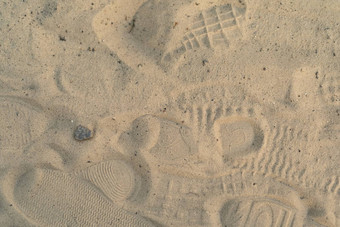 沙子海滩的足迹鞋子的足迹鞋子鞋子