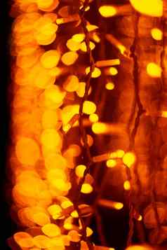 垂直圣诞节加兰墙玻璃窗口光橙色散焦模糊背景一年情绪