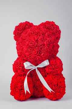 红色的泰迪熊玩具foamirane玫瑰白色条纹泰迪脖子股票照片孤立的白色背景