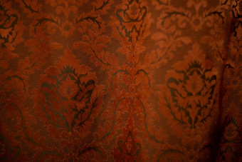 昂贵的黑暗橙色首页窗帘美丽的镶褶边的模式纹理拍摄好背景壁纸