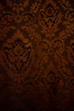 昂贵的黑暗橙色首页窗帘美丽的镶褶边的模式纹理拍摄好背景壁纸