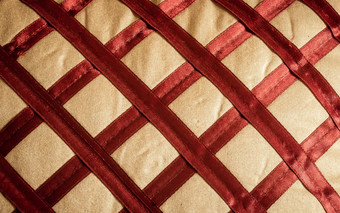 关闭摘要丝绸缎织物背景亚麻布纺织红色的织物交错对角模式场合自然帆布工作室拍摄复制空间房间文本