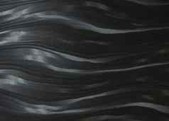 黑色的天鹅绒波浪纹理模式背景特写镜头
