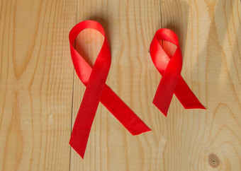 意识红色的丝带木背景世界一天战斗艾滋病<strong>促销</strong>活动公共支持<strong>健康</strong>人生活艾滋病毒12月