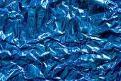 纹理皱巴巴的蓝色的箔塑料概念全球气候变暖
