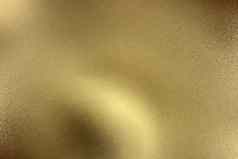 发光的黄金波金属板摘要纹理背景