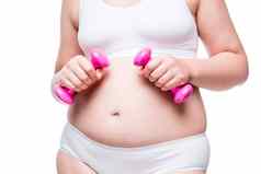 减肥女人概念白色内衣粉红色的哑铃