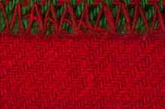 手工制作的针织绿色红色的背景