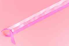 粉红色的丝带乳房癌症粉红色的背景复制空间