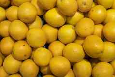 很多黄色的柠檬市场纹理背景柠檬收获健康的维生素食物柑橘类水果