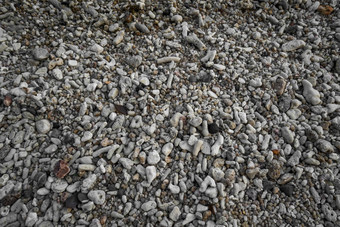 关闭圆形的抛光海滩岩石卵石石头海色彩斑斓的卵石石头