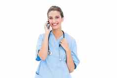 微笑棕色（的）头发的护士蓝色的实习医生风云使电话调用