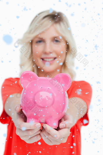 复合图像粉红色的小猪银行举行微笑有吸引力的女人