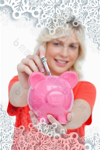 复合图像年轻的金发女郎女人把笔记粉红色的小猪银行