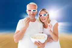 复合图像快乐夫妇穿眼镜吃爆米花
