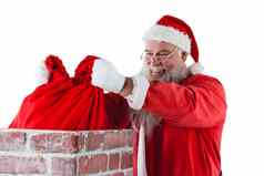 圣诞老人老人放置礼物盒子烟囱